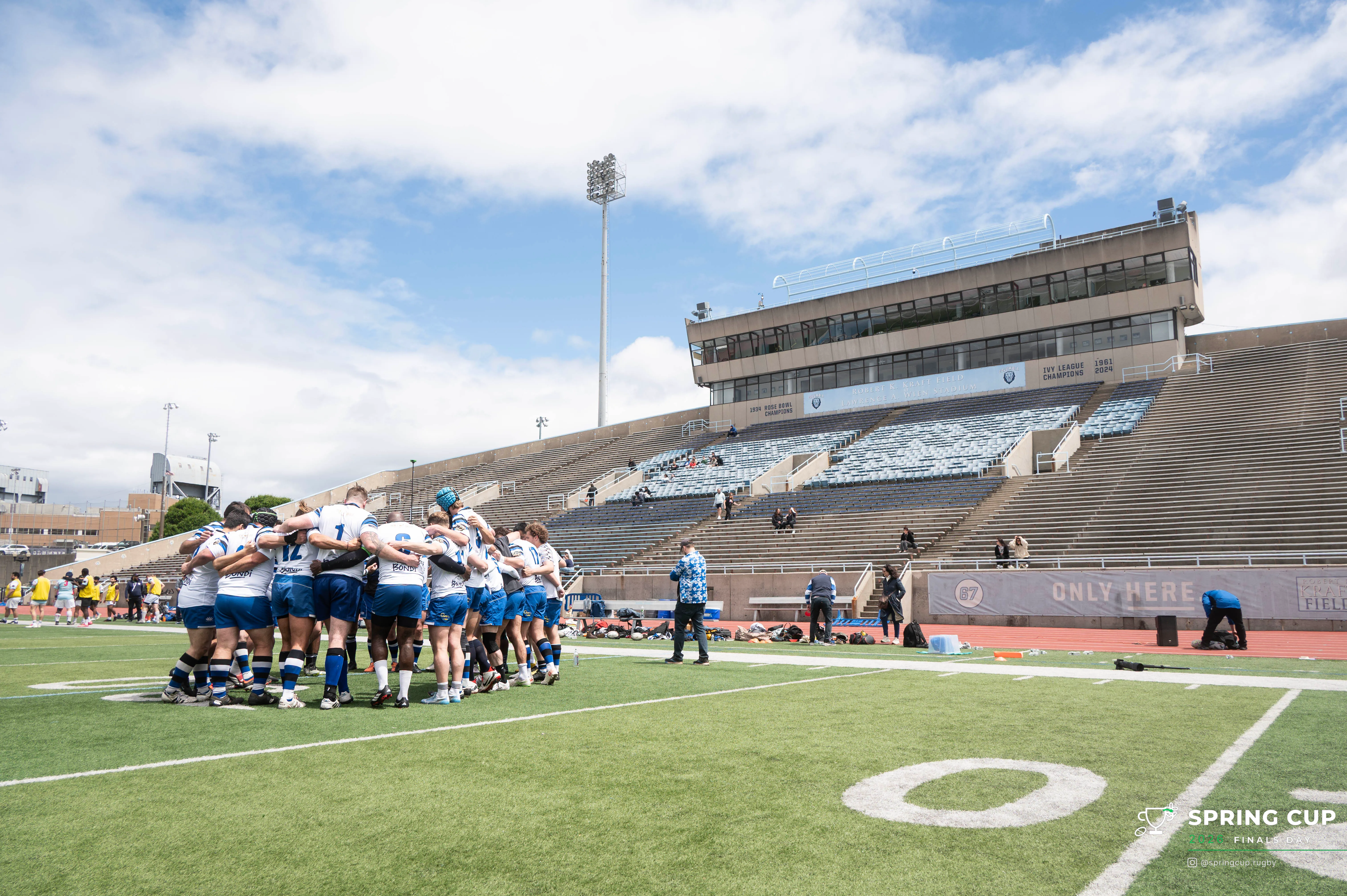 A squad huddles together on the pitch at Columbia’s Wien Stadium before kickoff